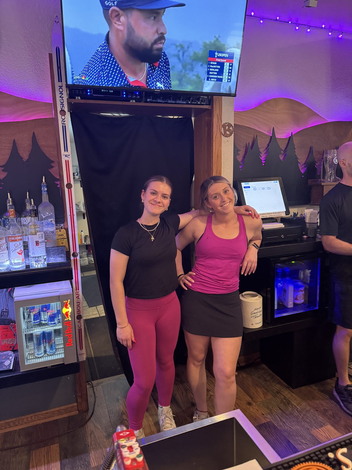Bartenders working behind the bar